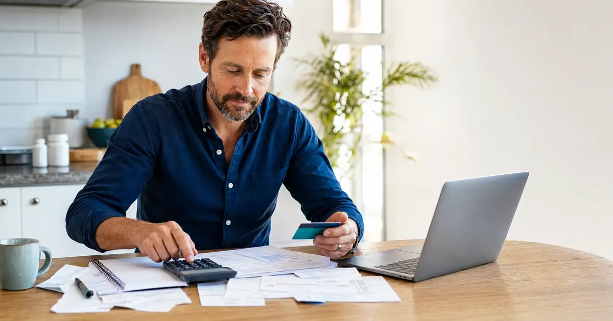 American professional reviewing health plan records and calculating a 2026 HSA contribution